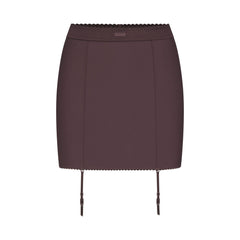 SKIMS BODY MINI GARTER SKIRT | RAISIN FLAT ON A WHITE BACKGROUND | FLT