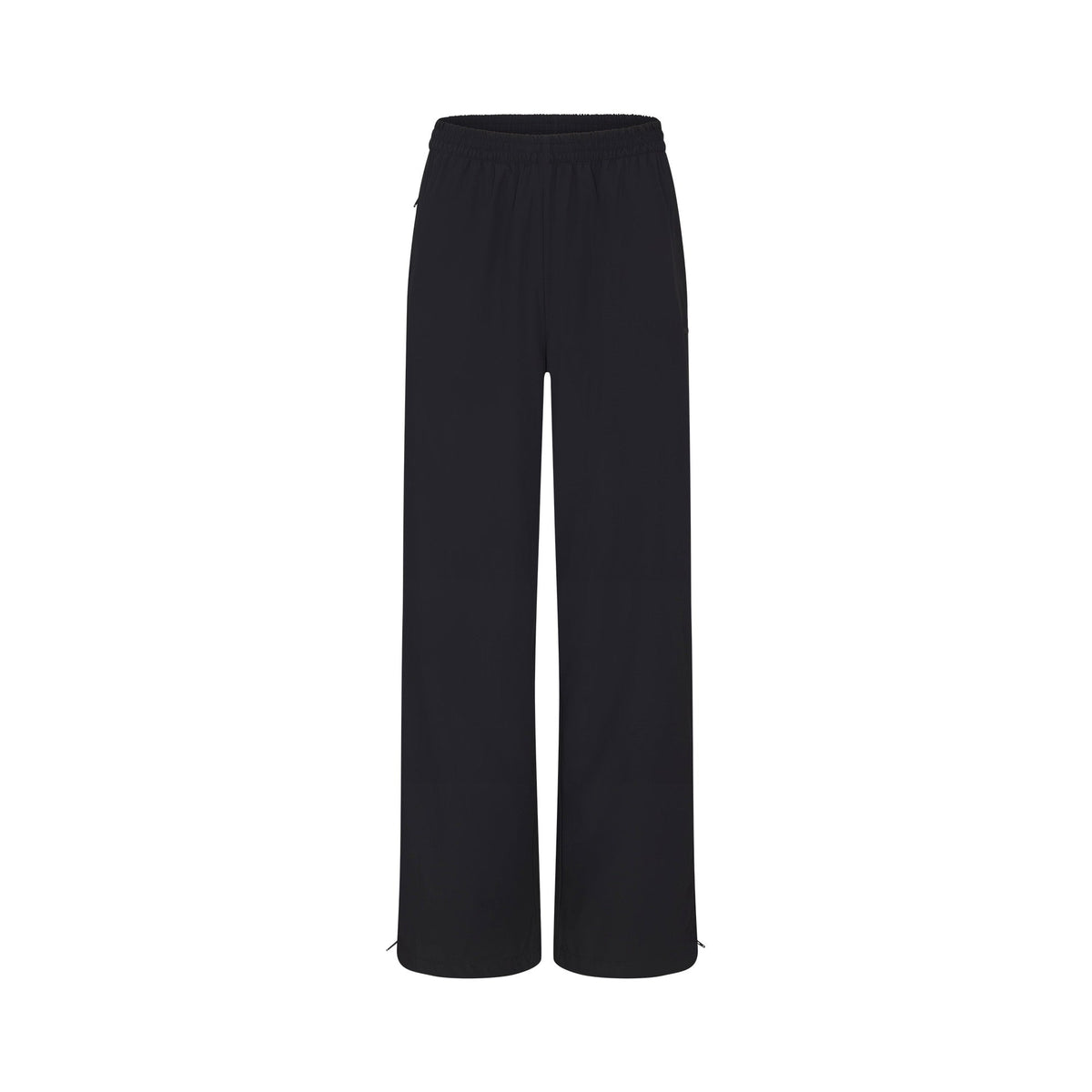 NikeSKIMS WOVEN NYLON OVERSIZED TRACK PANT | OBSIDIAN FLAT ON A WHITE BACKGROUND | FLT
