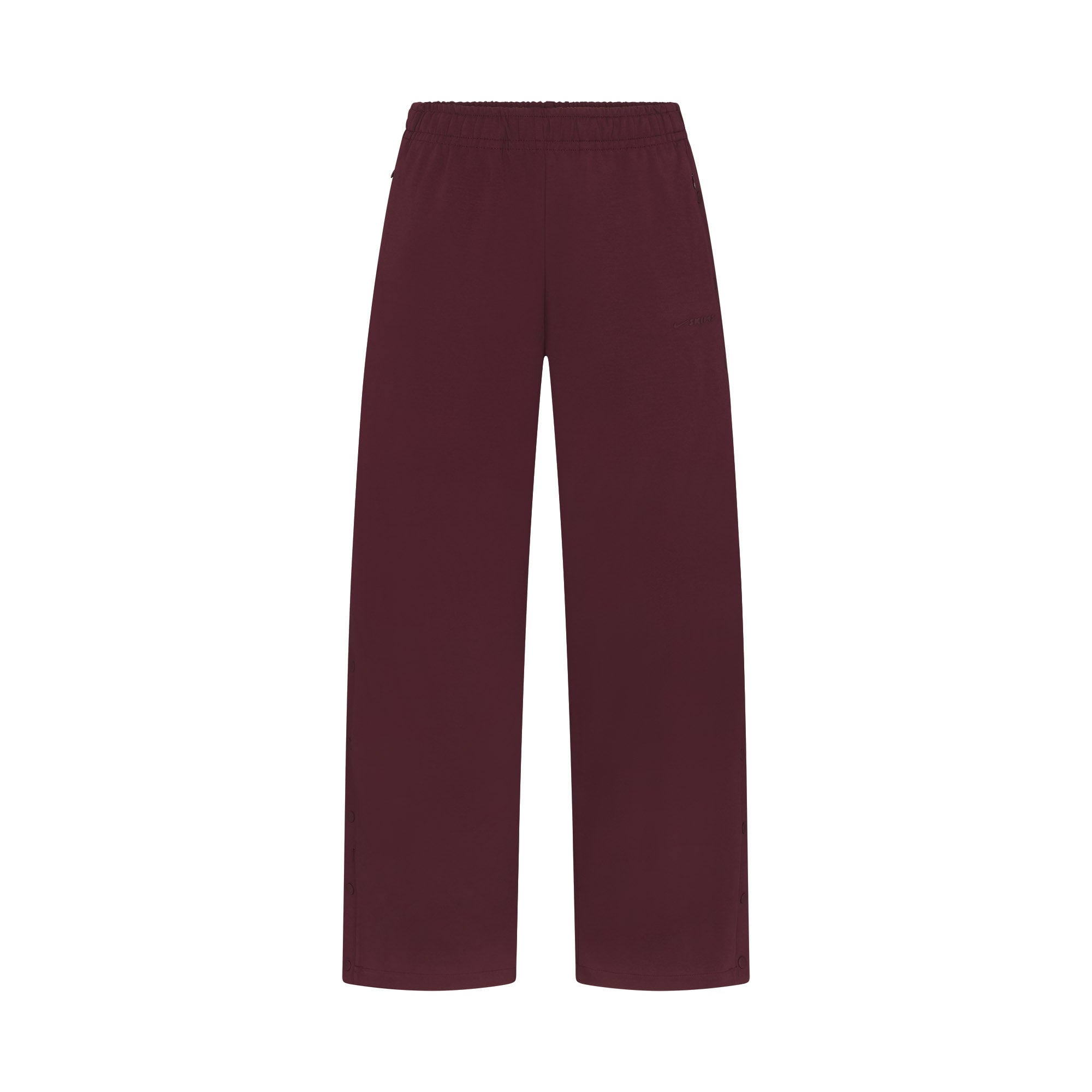 NikeSKIMS MATTE TRICOT SIDE SNAPS PANT | CURRANT FLAT ON A WHITE BACKGROUND | FLT