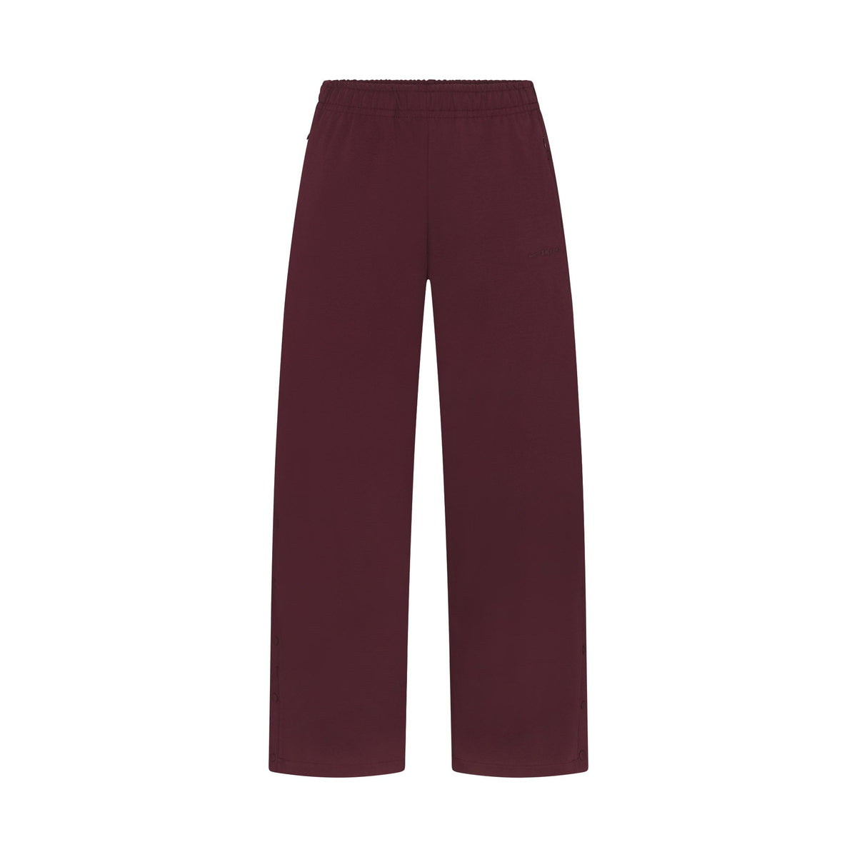 NikeSKIMS MATTE TRICOT SIDE SNAPS PANT | CURRANT FLAT ON A WHITE BACKGROUND | FLT