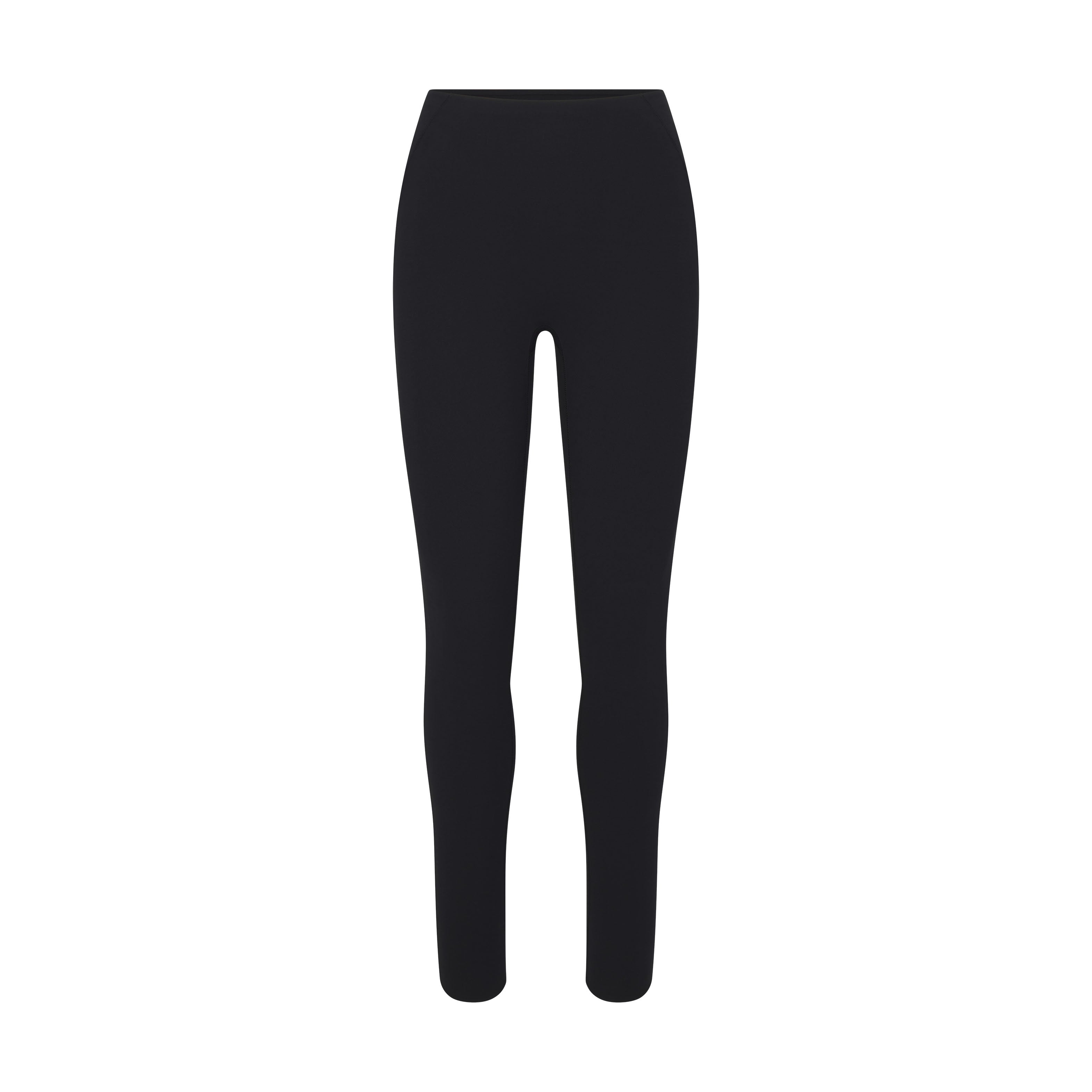 NikeSKIMS STUDIO STRETCH 26" LEGGING | OBSIDIAN LAYS FLAT ON A WHITE BACKGROUND | FLT