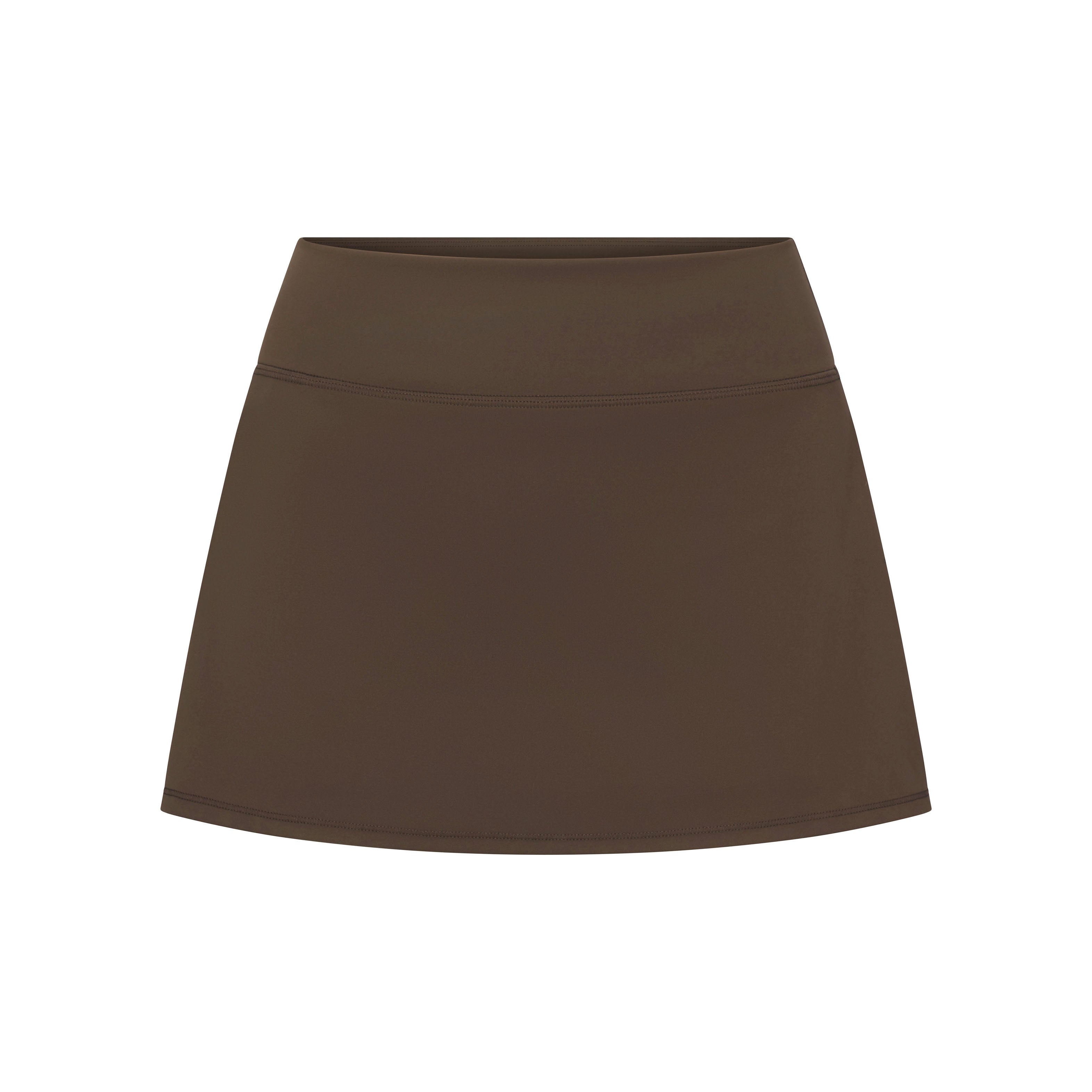 NikeSKIMS MATTE SKORT | NSKM DARK SEPIA LAYS FLAT ON A WHITE BACKGROUND | FLT