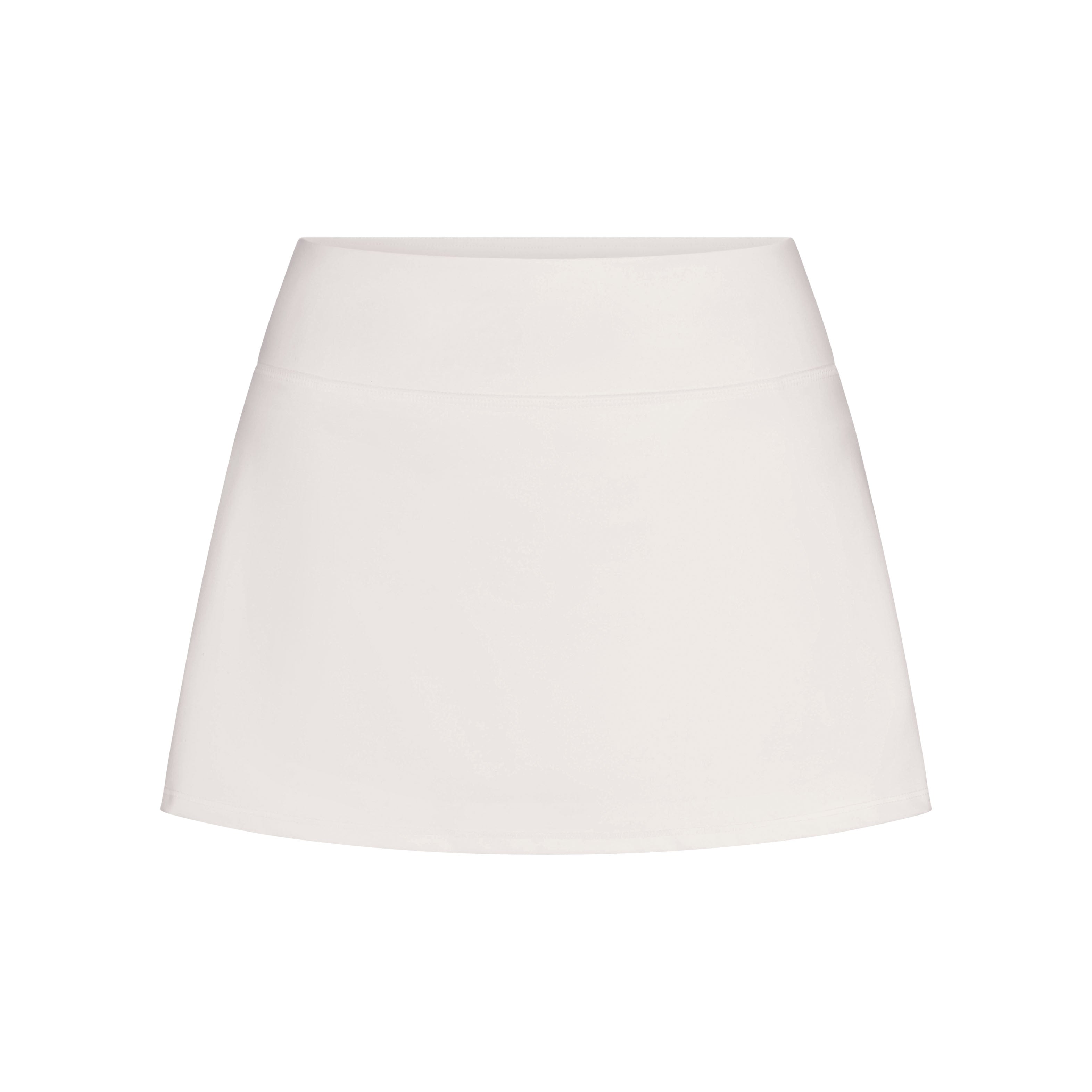 NikeSKIMS MATTE SKORT | IVORY LAYS FLAT ON A WHITE BACKGROUND | FLT