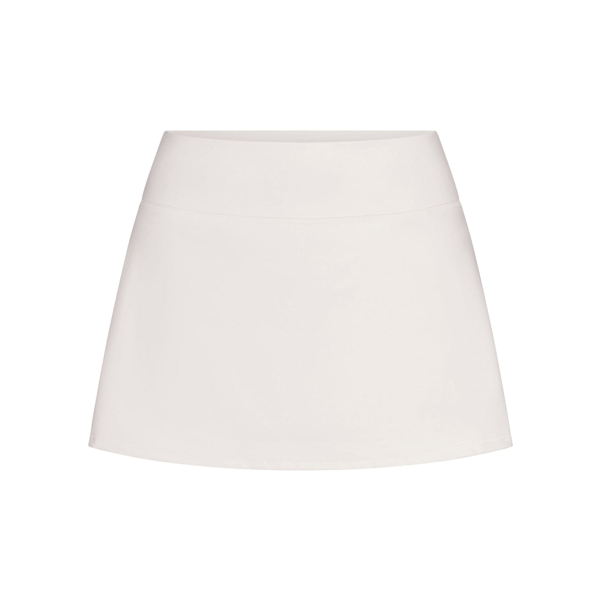 NikeSKIMS MATTE SKORT | IVORY LAYS FLAT ON A WHITE BACKGROUND | FLT