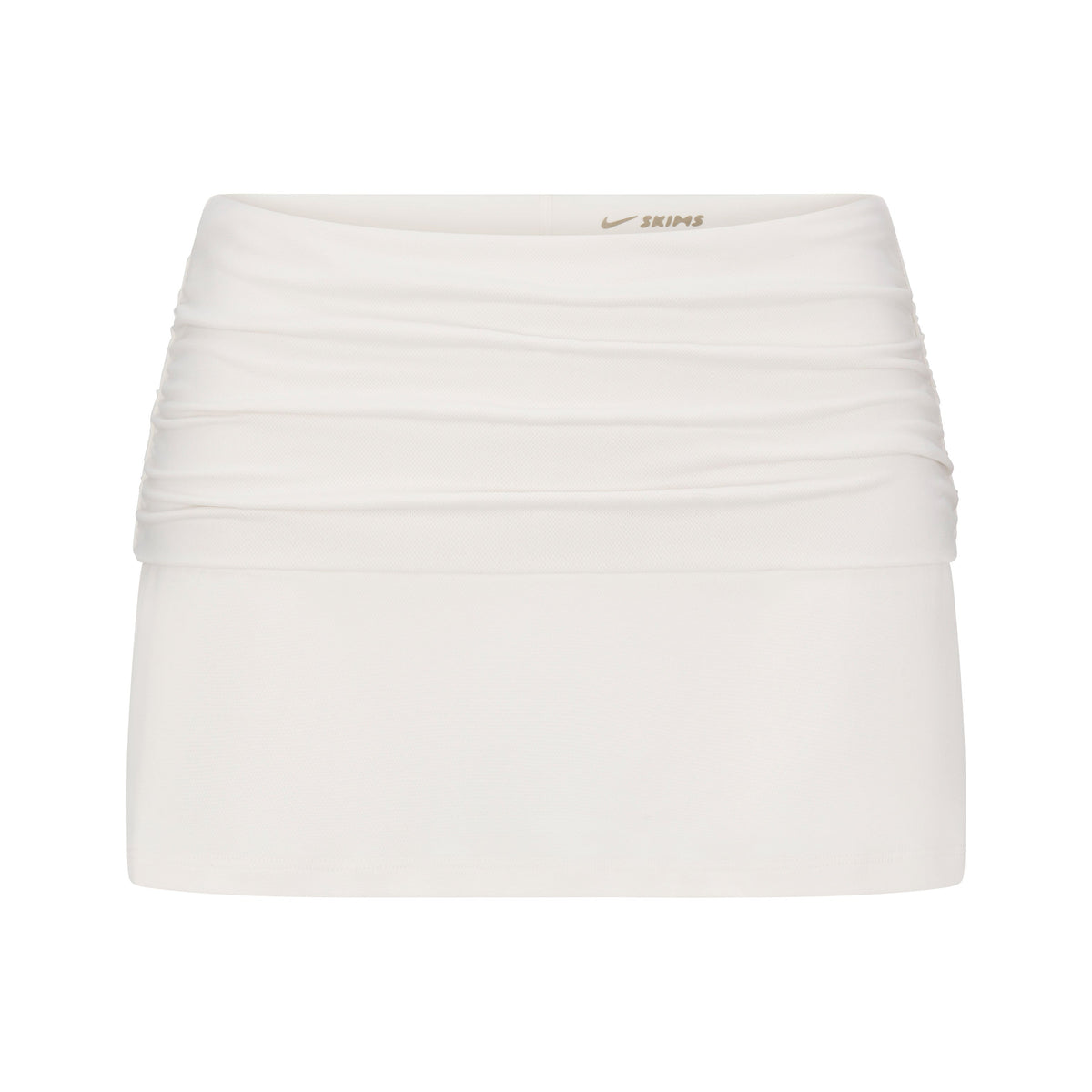NikeSKIMS AIRY FOLDOVER SKORT | IVORY LAYS FLAT ON A WHITE BACKGROUND | FLT