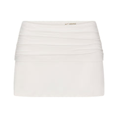 NikeSKIMS AIRY FOLDOVER SKORT | IVORY LAYS FLAT ON A WHITE BACKGROUND | FLT