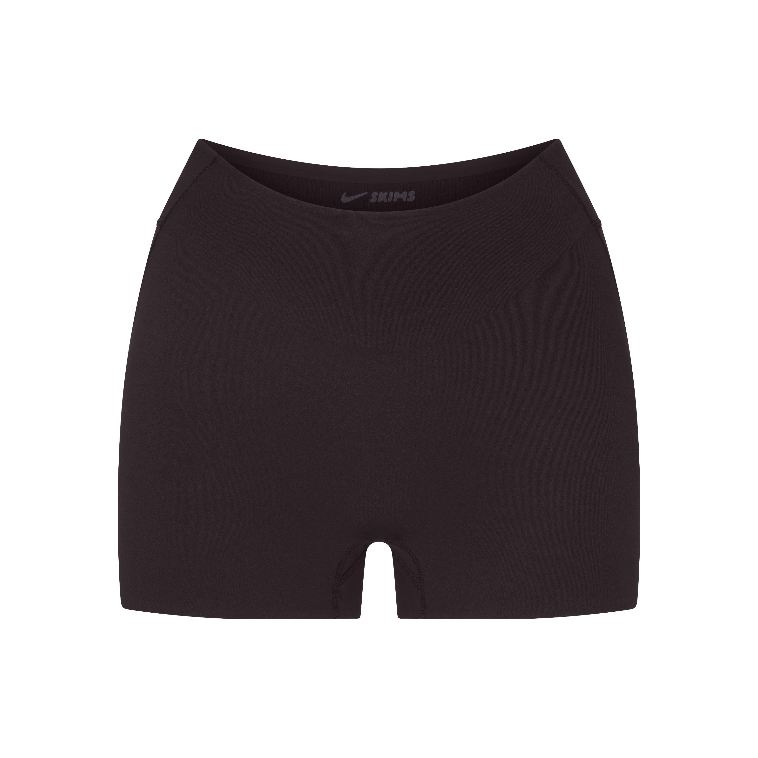 NikeSKIMS STUDIO STRETCH DIPPED 2" SHORT | DARK ROAST LAYS FLAT ON A WHITE BACKGROUND | FLT