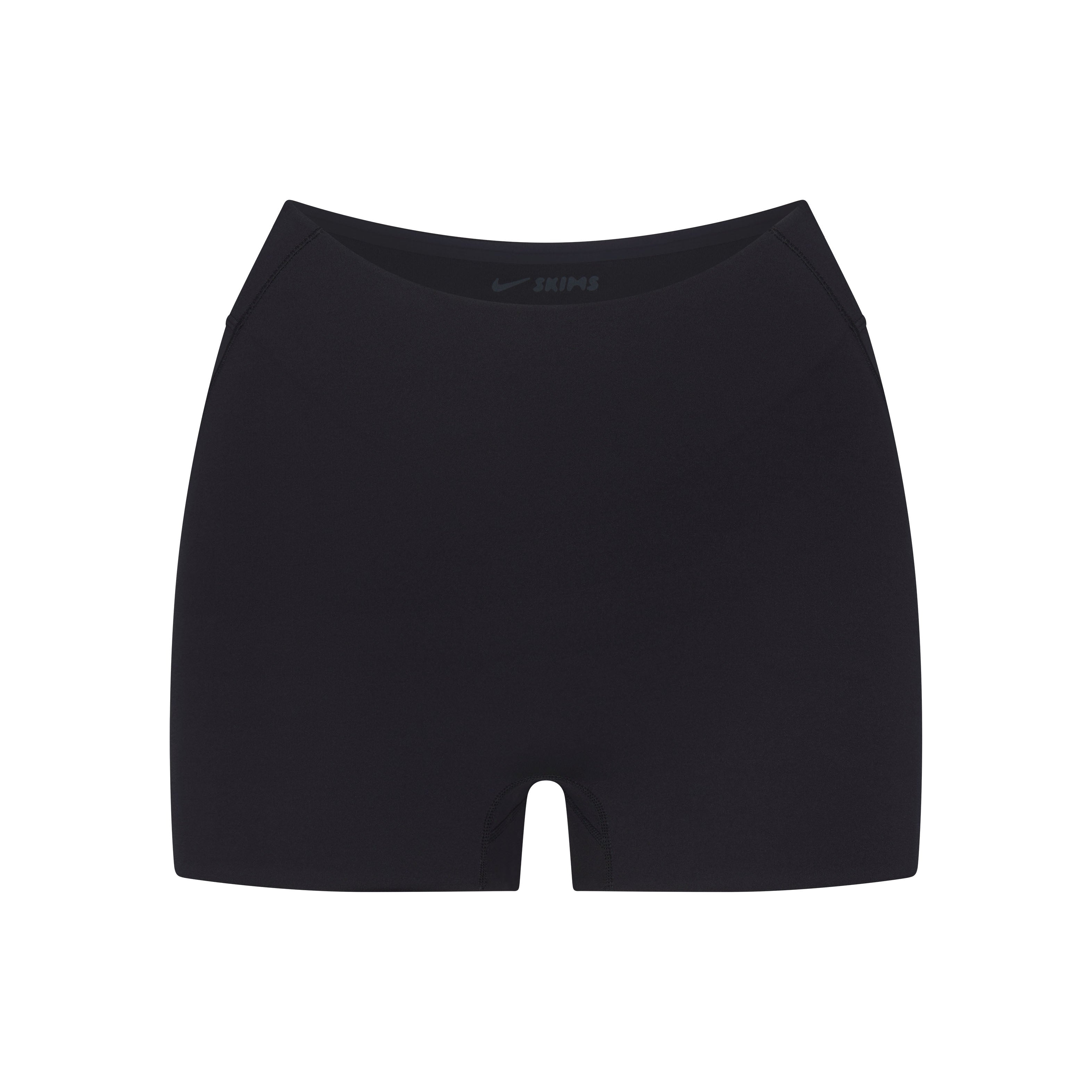 NikeSKIMS STUDIO STRETCH DIPPED 2" SHORT | OBSIDIAN LAYS FLAT ON A WHITE BACKGROUND | FLT