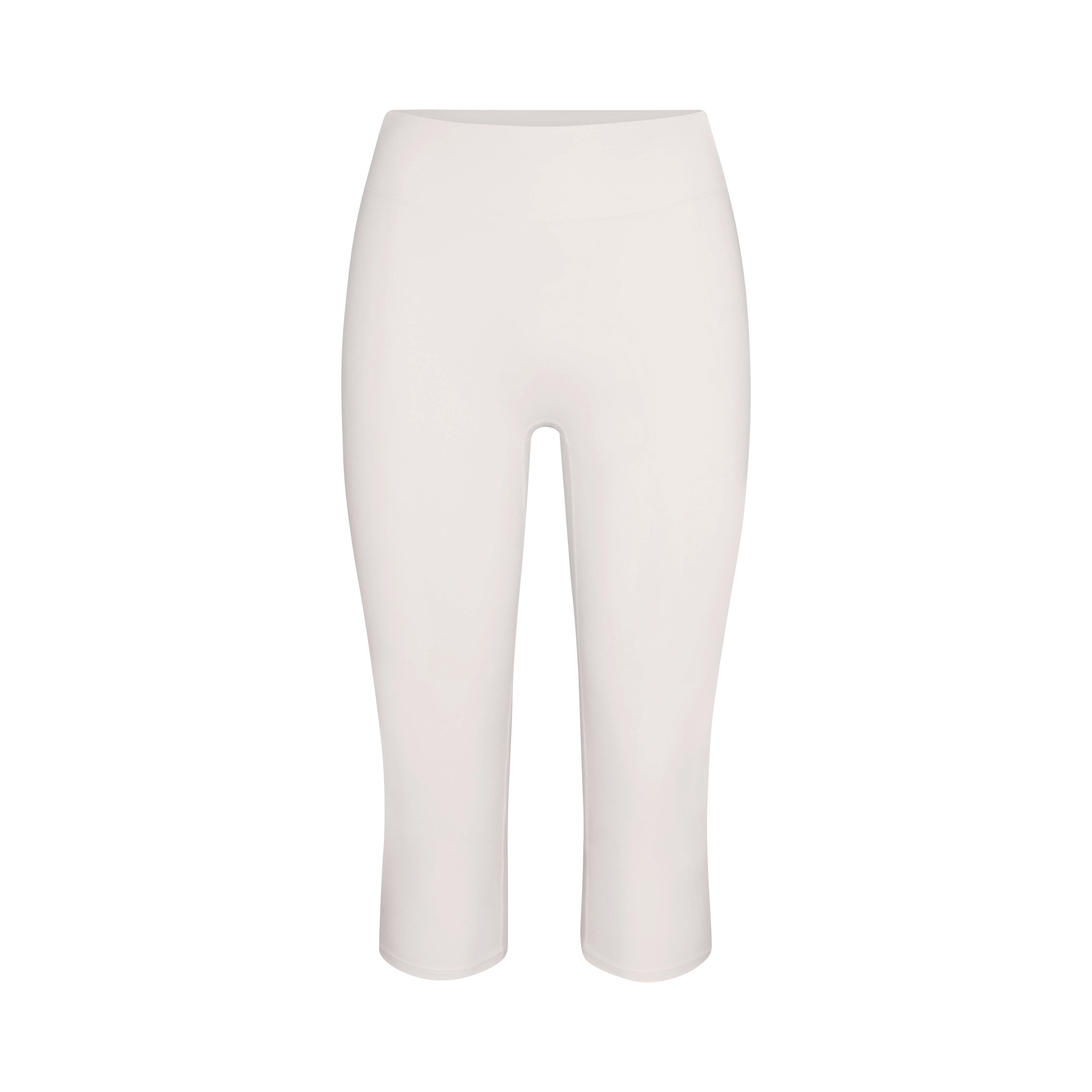 NikeSKIMS MATTE CROP 17" LEGGING | IVORY LAYS FLAT ON A WHITE BACKGROUND | FLT