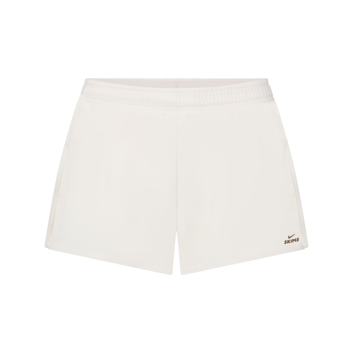 NikeSKIMS STRETCH NYLON RUNNER SHORT | IVORY LAYS FLAT ON A WHITE BACKGROUND | FLT