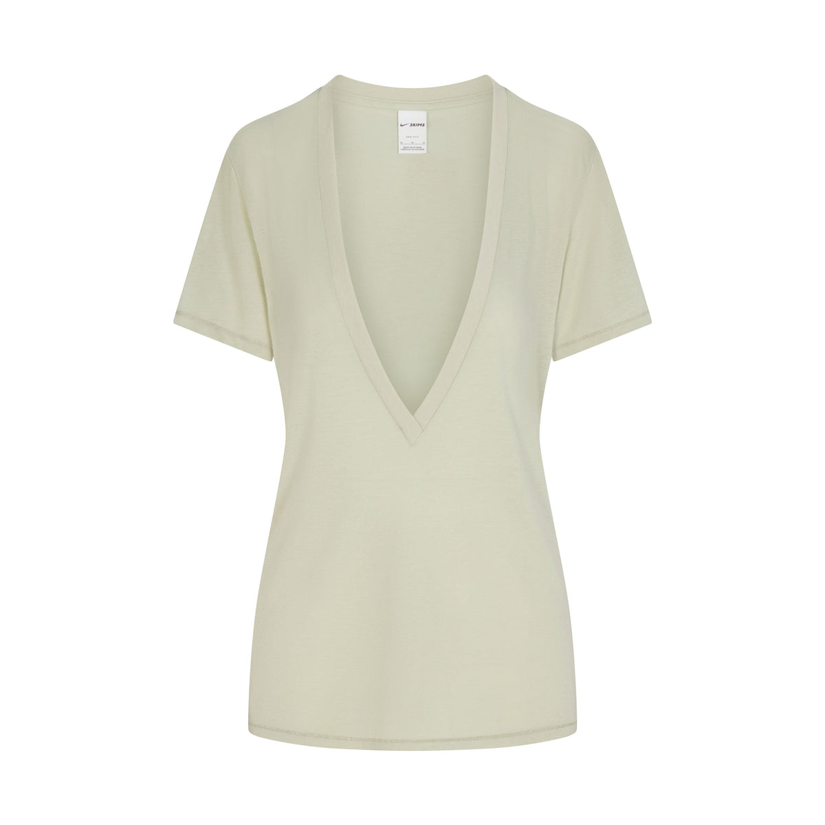 NikeSKIMS PERFORMANCE COTTON BLEND SHORT SLEEVE V-NECK TOP | TALC & LAYS FLAT ON A WHITE BACKGROUND | FLT