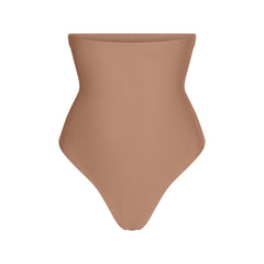 SKIMS BODY CORE SCULPT HIGH-WAISTED THONG | SIENNA FLAT ON A WHITE BACKGROUND | FLT | FLT