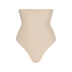 SKIMS BODY CORE SCULPT HIGH-WAISTED THONG | SAND FLAT ON A WHITE BACKGROUND | FLT | FLT