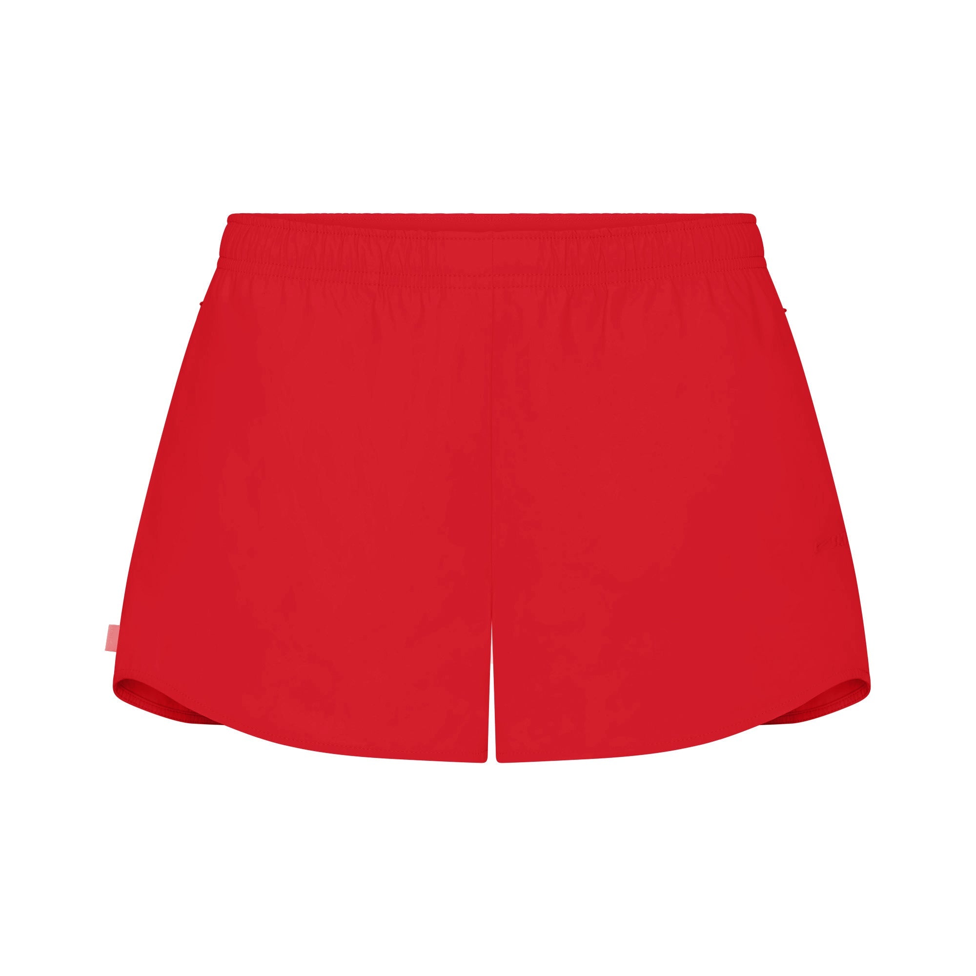 NikeSKIMS WOVEN NYLON 2.5" RUNNER SHORT | RUBY FLAT ON A WHITE BACKGROUND | FLT