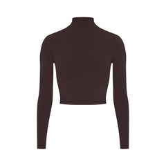 NikeSKIMS VINTAGE SEAMLESS MOCK NECK CROP TOP | PHOENIX FLAT ON A WHITE BACKGROUND | FLT