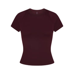 NikeSKIMS AIRY BABY TEE | CURRANT FLAT ON A WHITE BACKGROUND | FLT