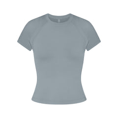 NikeSKIMS AIRY BABY TEE | WASHED PACIFIC FLAT ON A WHITE BACKGROUND | FLT