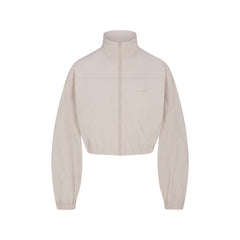 NikeSKIMS WOVEN NYLON CROP JACKET | STONE FLAT ON A WHITE BACKGROUND | FLT
