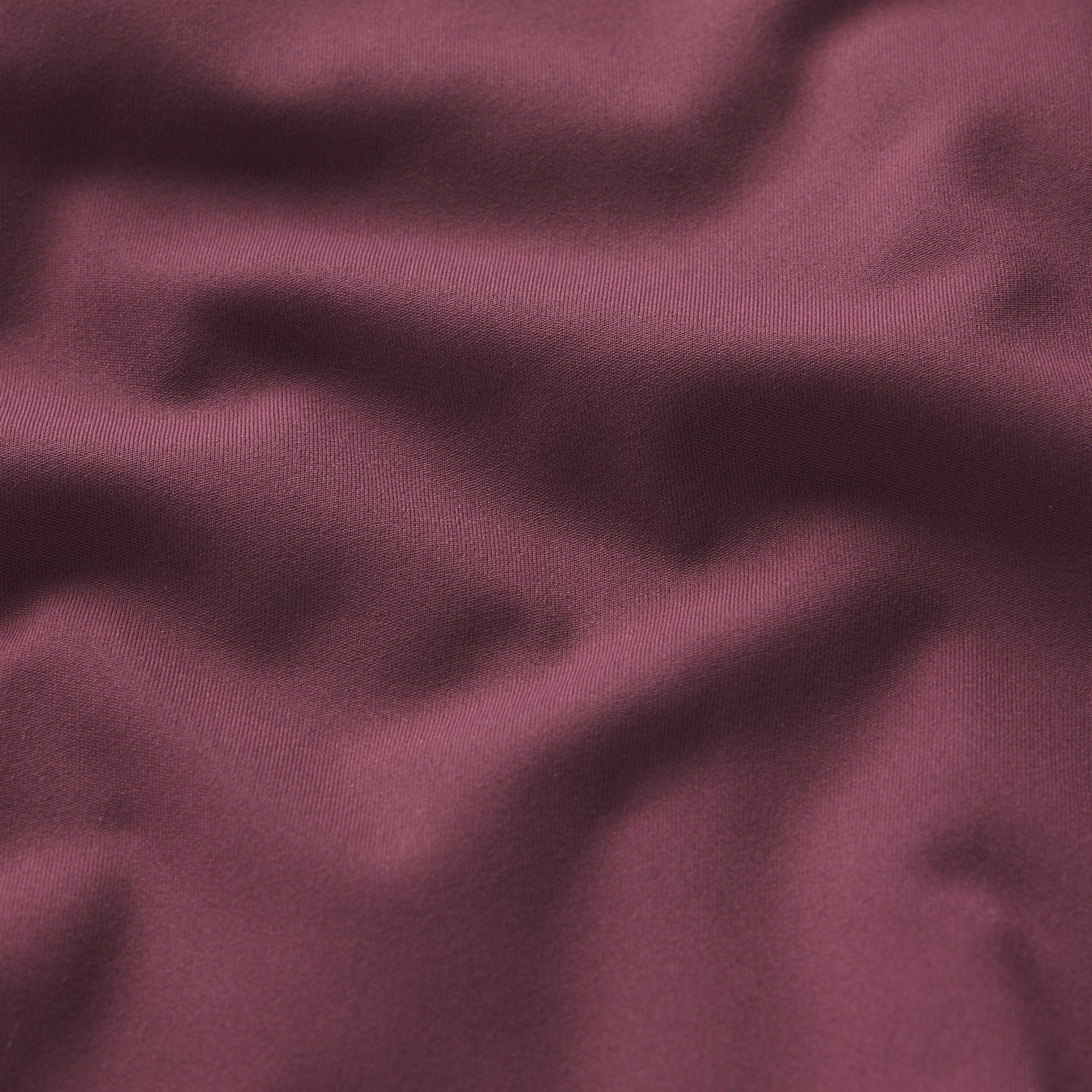 NikeSKIMS MATTE RACER BACK TANK | CURRANT ON A MODEL SIDE VIEW @ | FOCUS: 0.0, 1.0, 0.9