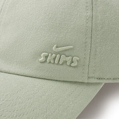 NikeSKIMS ACCESSORIES CLUB CAP | TALC ON A MODEL SIDE VIEW @ | FOCUS: 0.0, 1.0, 0.9