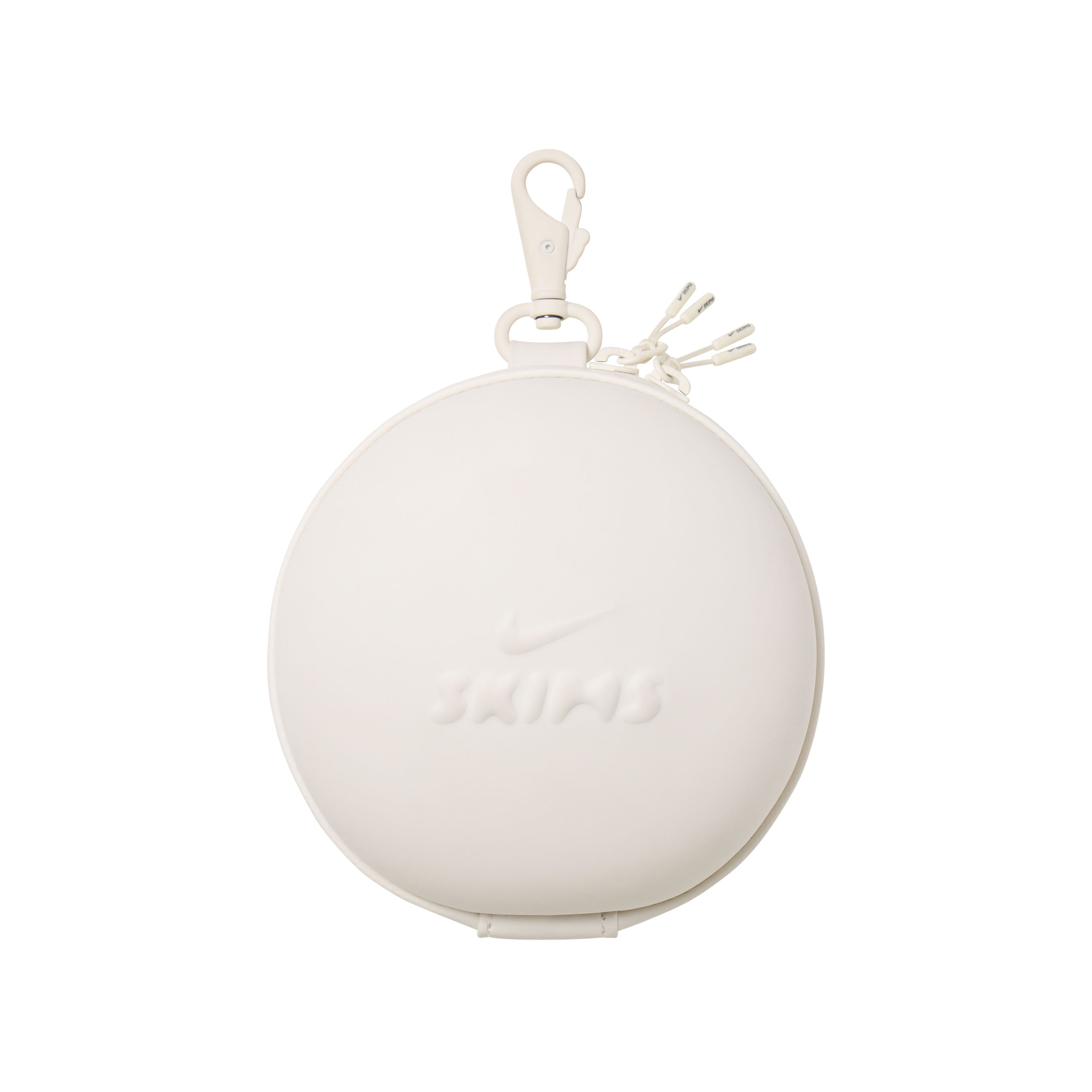 NikeSKIMS ACCESSORIES HARDSHELL ROUND CASE | IVORY LAYS FLAT ON A WHITE BACKGROUND