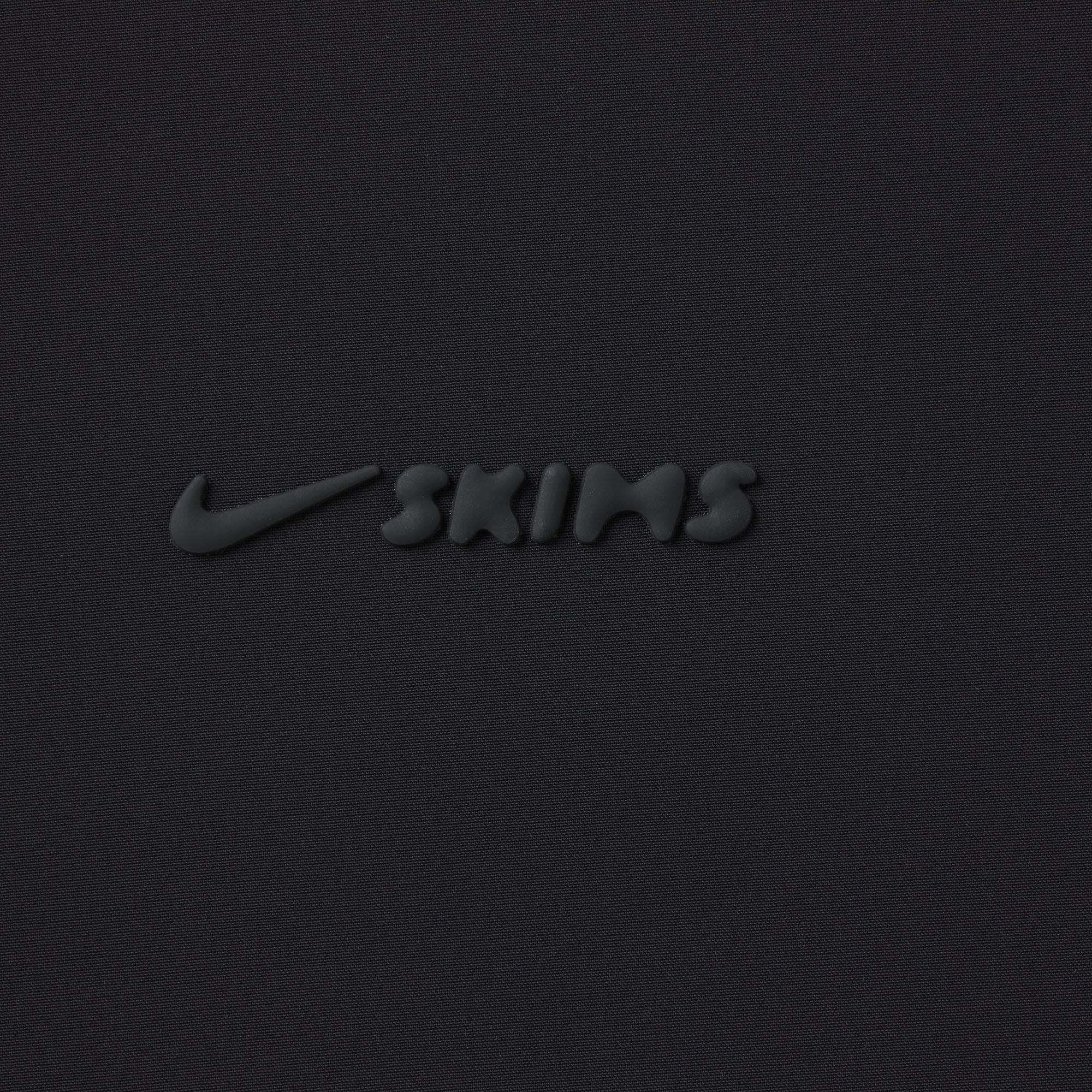 NikeSKIMS WOVEN NYLON OVERSIZED TRACK PANT | OBSIDIAN