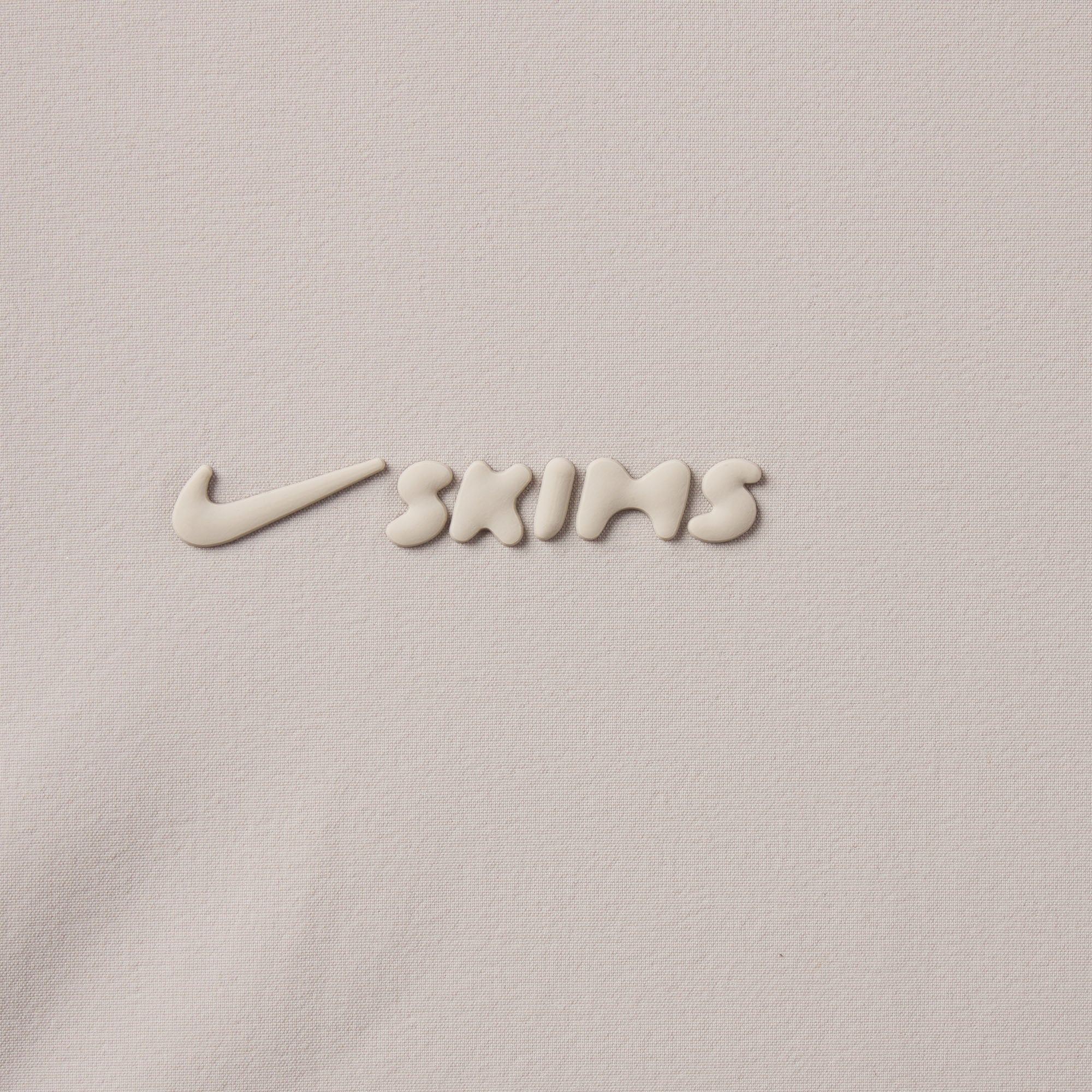 NikeSKIMS WOVEN NYLON 2.5" RUNNER SHORT | STONE ADDITIONAL FABRIC DETAILS