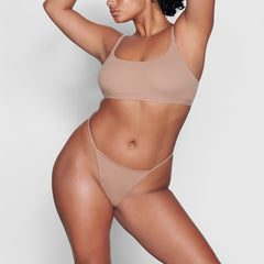 ON A MODEL FRONT VIEW FITS EVERYBODY T STRING THONG IN SIENNA
