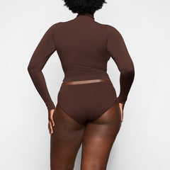 SOFT SMOOTHING BRIEF WORN BY A MODEL IN BACK VIEW