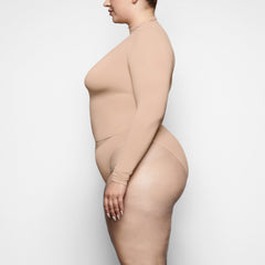 SOFT SMOOTHING BRIEF WORN BY A MODEL IN SIDE VIEW