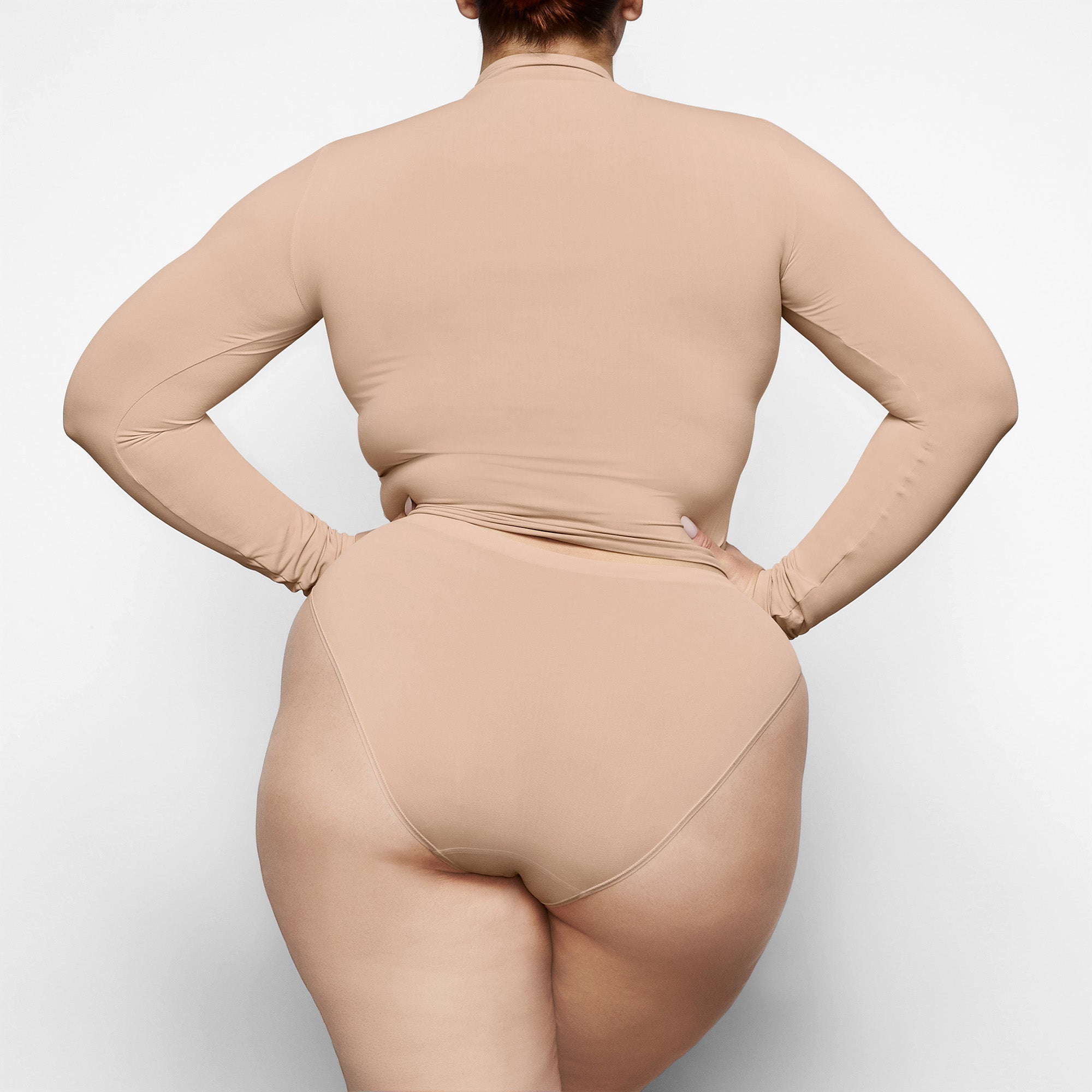SOFT SMOOTHING BRIEF WORN BY A MODEL IN BACK VIEW