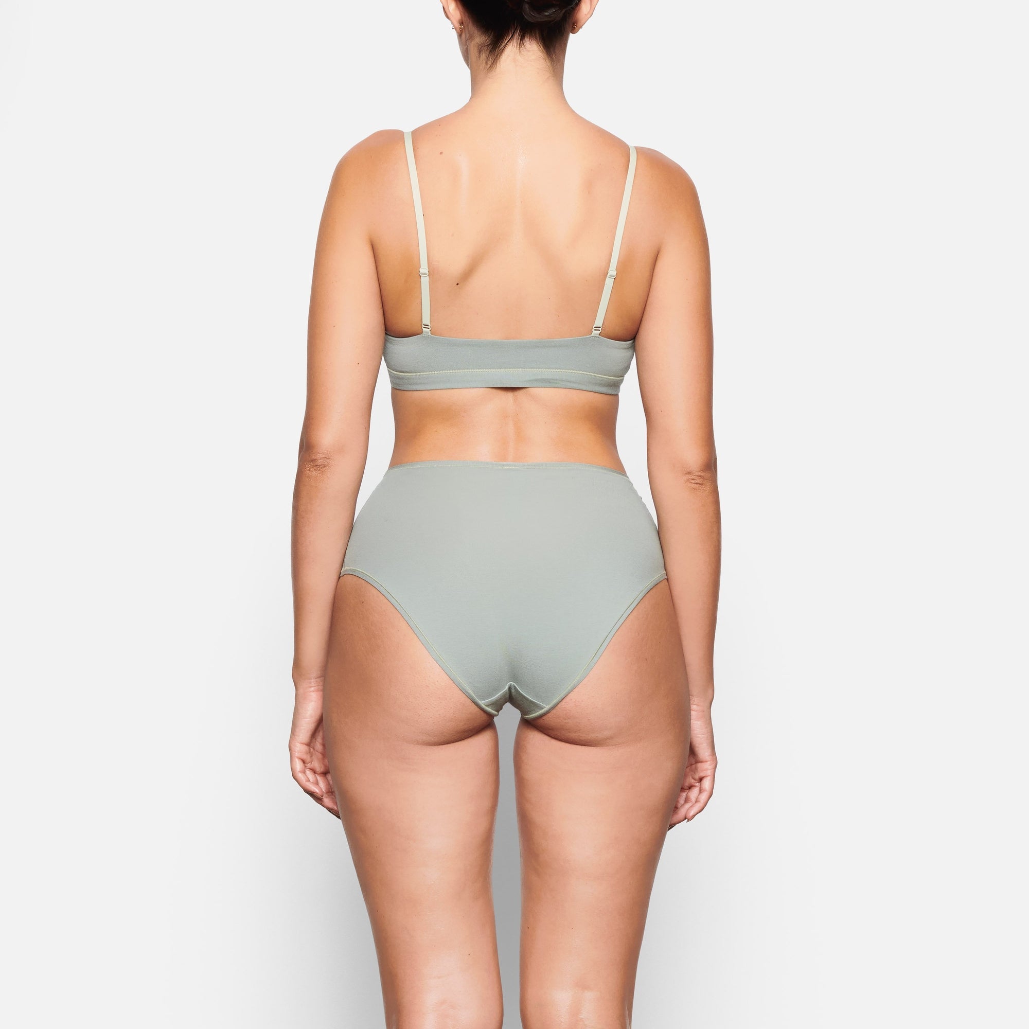BACK VIEW OF THE COTTON JERSEY FULL BRIEF ON A MODEL