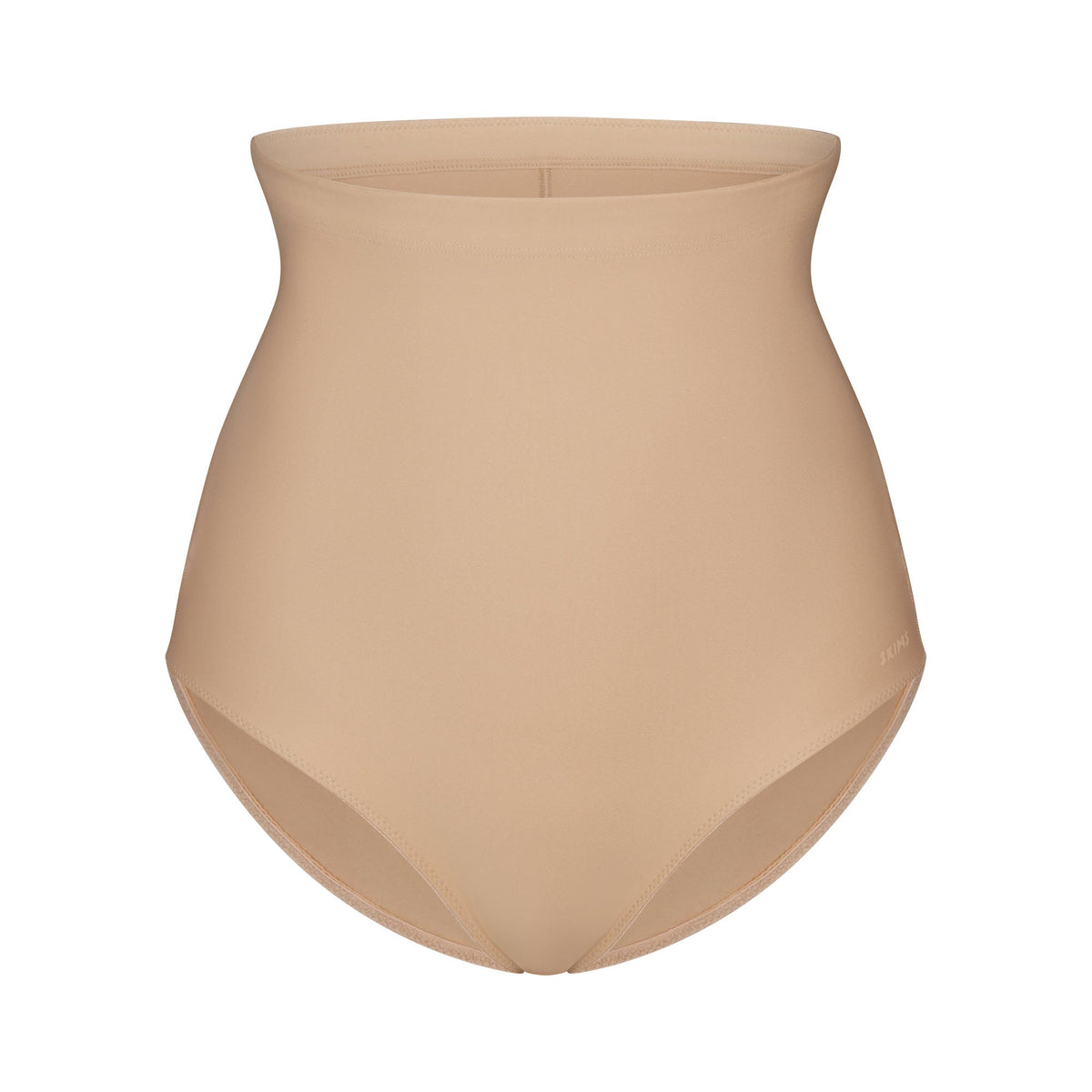 SKIMS BODY CORE SCULPT BUTT LIFTING BRIEF | CLAY FLAT ON A WHITE BACKGROUND | FLT