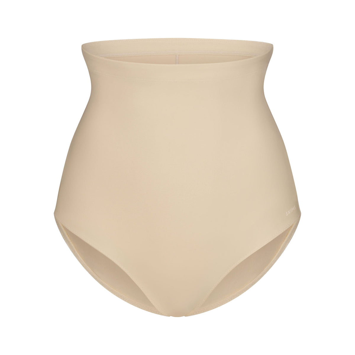 SKIMS BODY CORE SCULPT BUTT LIFTING BRIEF | SAND FLAT ON A WHITE BACKGROUND | FLT