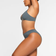 COTTON JERSEY CHEEKY TANGA WORN BY A MODEL IN SIDE VIEW