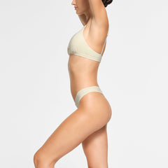 COTTON JERSEY DIPPED THONG WORN BY A MODEL IN SIDE VIEW