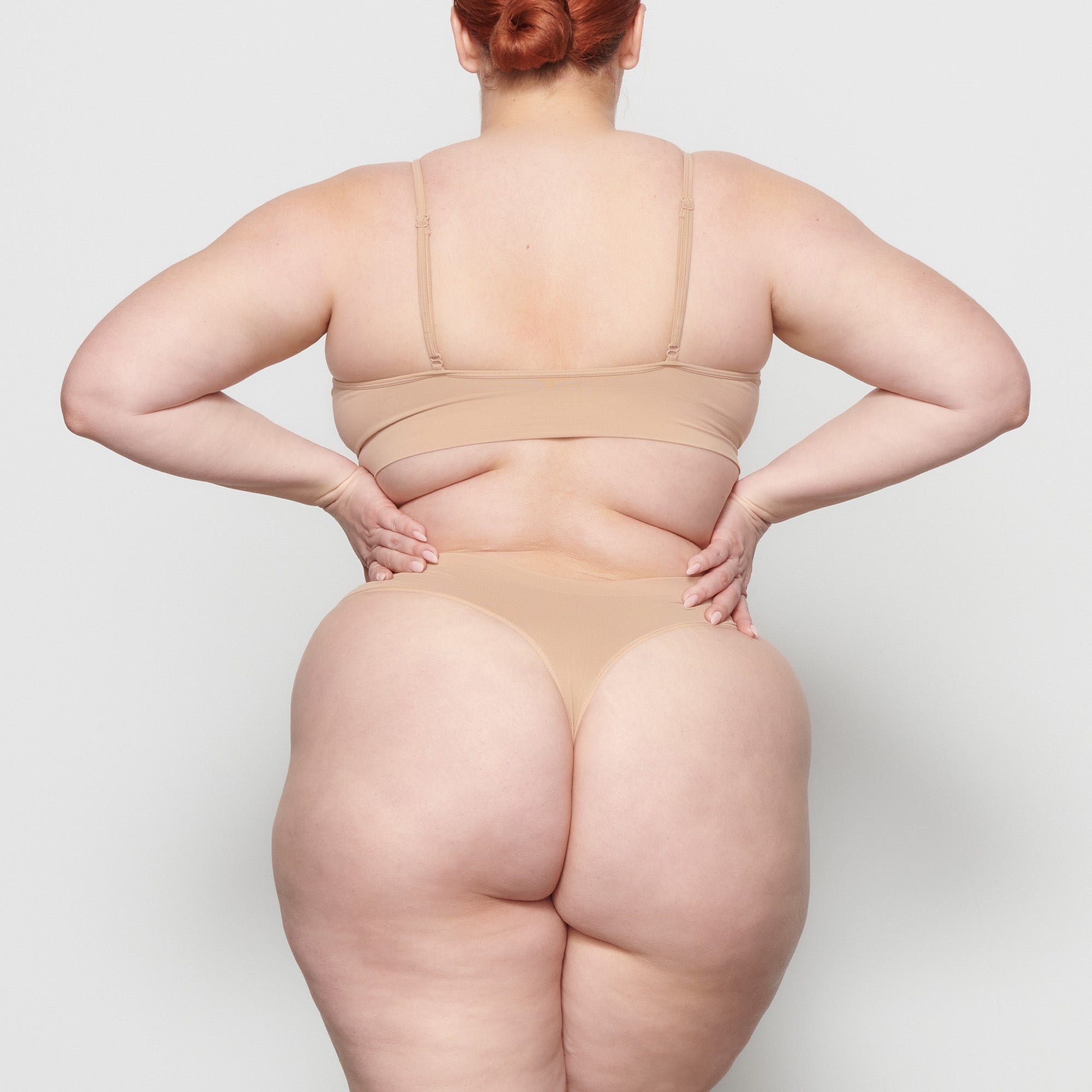 SOFT SMOOTHING THONG WORN BY A MODEL IN BACK VIEW