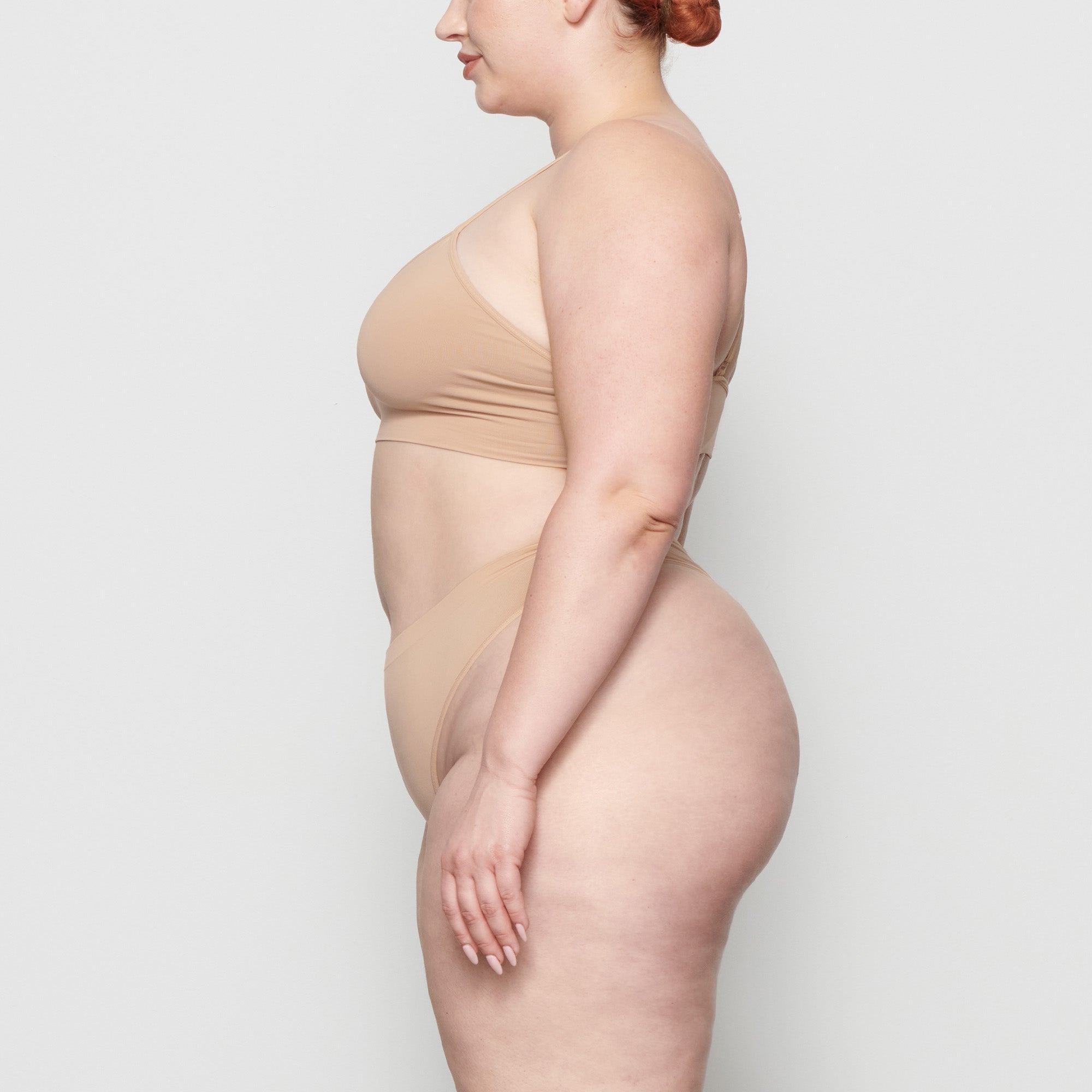 SOFT SMOOTHING THONG WORN BY A MODEL IN SIDE VIEW