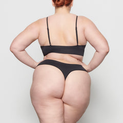 SOFT SMOOTHING THONG WORN BY A MODEL IN BACK VIEW
