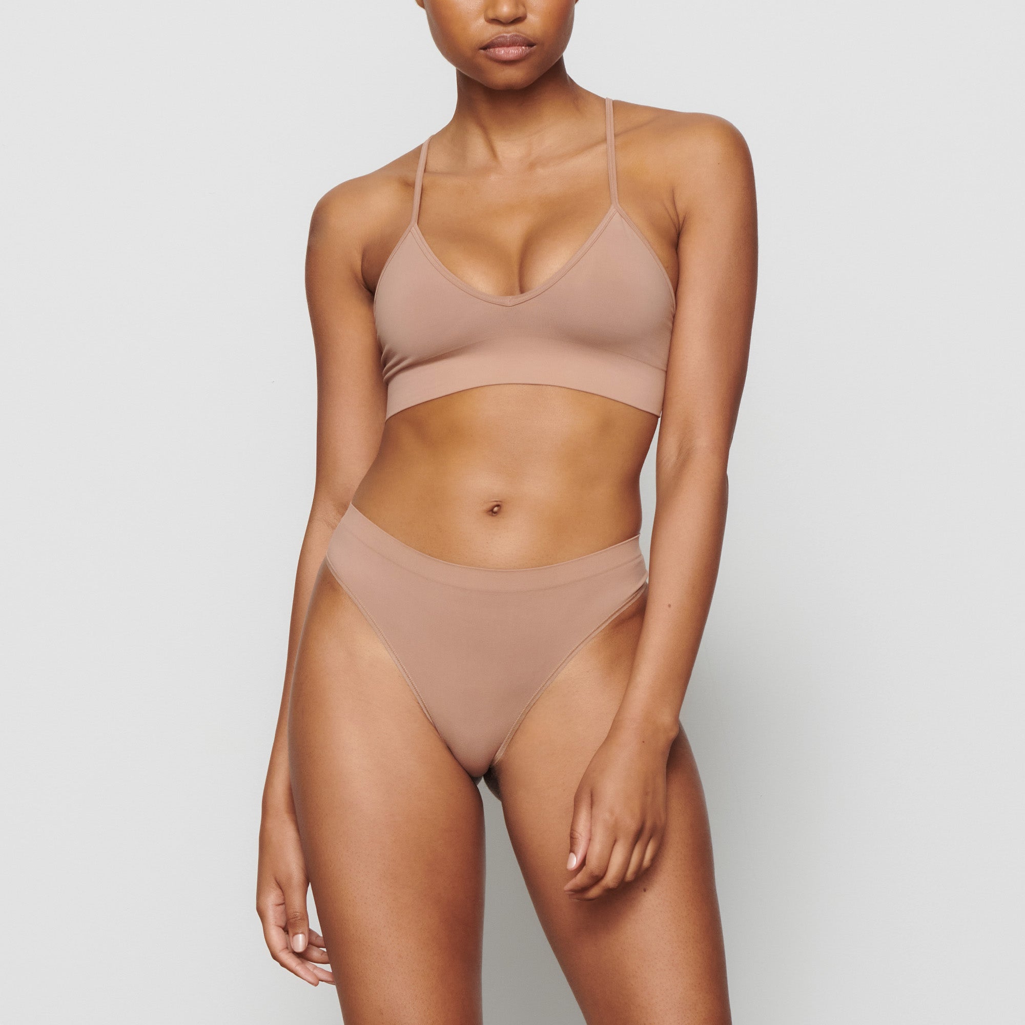 SOFT SMOOTHING THONG WORN BY A MODEL IN FRONT VIEW @ | FOCUS: 0.0, 1.0, 0.9