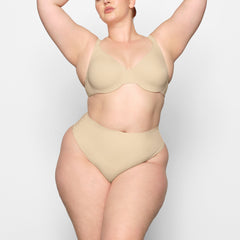SMOOTHING HIGH WAIST THONG WORN BY A MODEL IN FRONT VIEW 