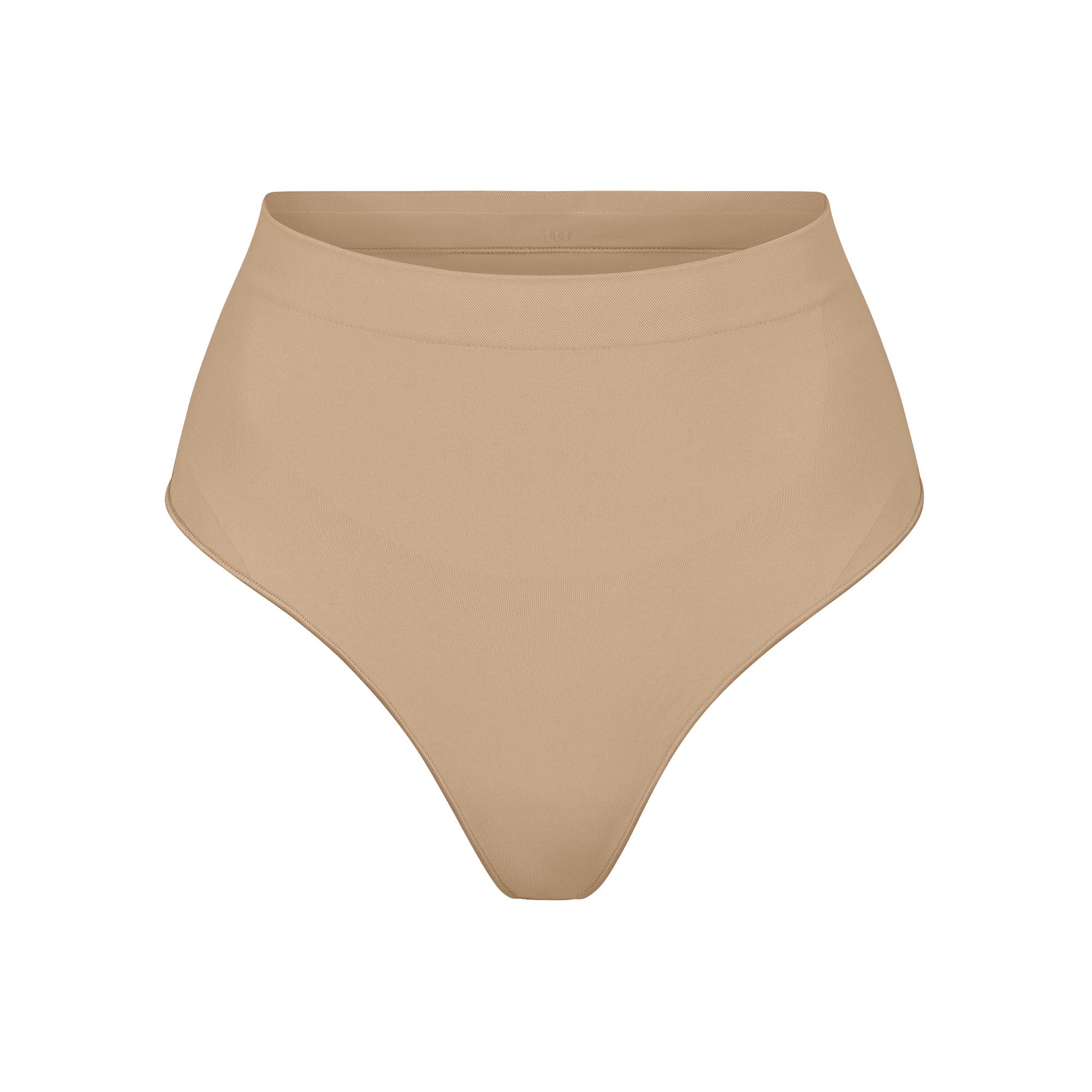 SEAMLESS SCULPT MID WAIST THONG | CLAY (SHAPEWEAR THONGS, PANTIES) LAYS FLAT ON A WHITE BACKGROUND | FLT