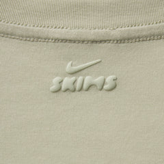 NikeSKIMS PERFORMANCE COTTON BLEND SHORT SLEEVE V-NECK TOP | TALC & LAYS FLAT ON A WHITE BACKGROUND | FLT
