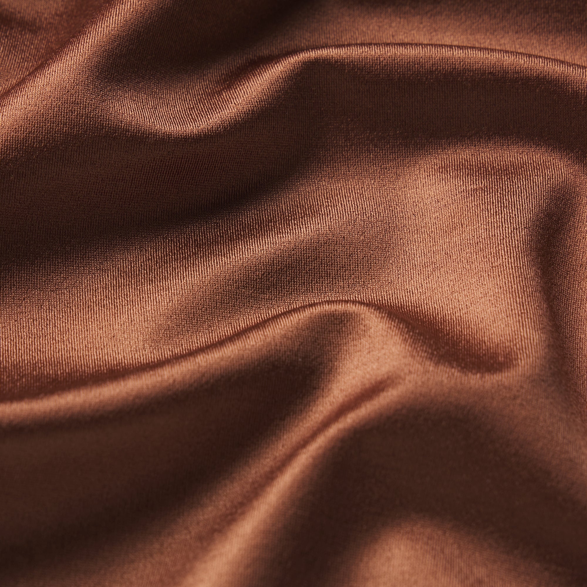 NikeSKIMS SATIN SHINE RACERBACK BRA | CAROB BROWN & LAYS FLAT ON A WHITE BACKGROUND | FLT