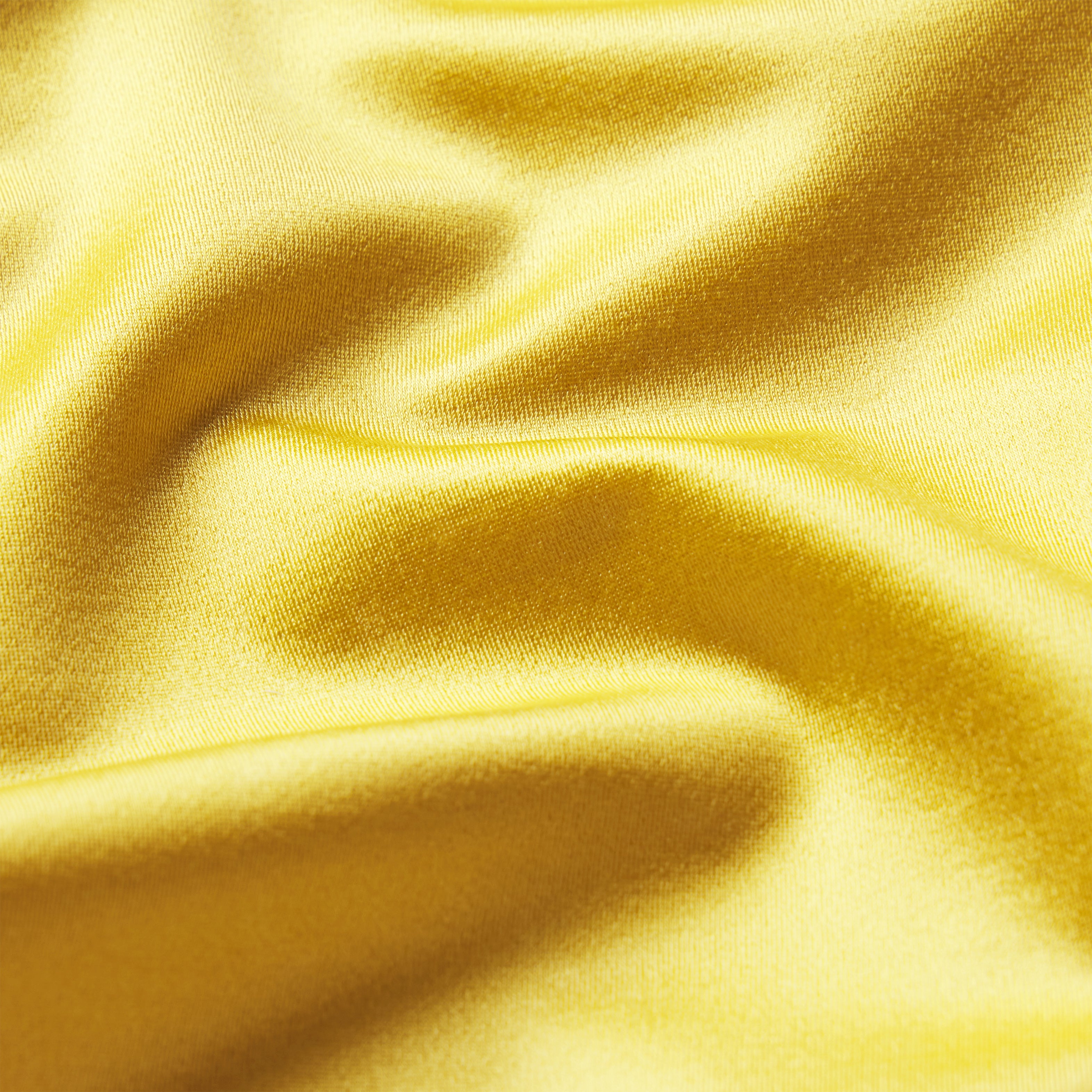 NikeSKIMS SATIN SHINE PLUNGE T-BACK BRA | CITRINE & LAYS FLAT ON A WHITE BACKGROUND | FLT