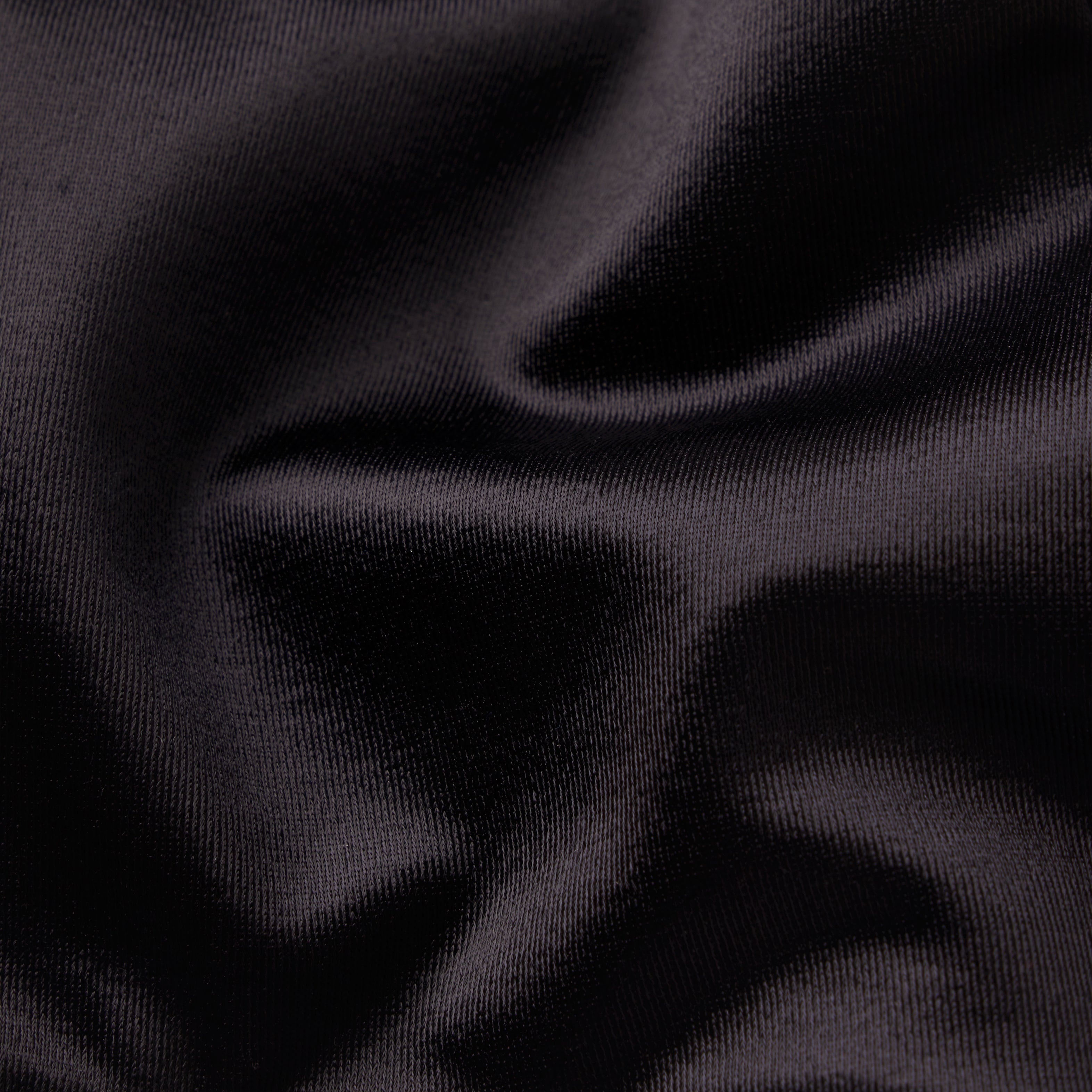 NikeSKIMS SATIN SHINE RACERBACK BRA | OBSIDIAN & LAYS FLAT ON A WHITE BACKGROUND | FLT