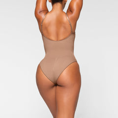 SEAMLESS SCULPT BRIEF BODYSUIT ON A MODEL BACK VIEW