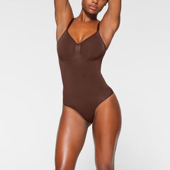 SEAMLESS SCULPT BRIEF BODYSUIT WORN BY A MODEL IN FRONT VIEW 