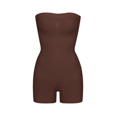 SEAMLESS SCULPT STRAPLESS SHORTIE BODYSUIT | COCOA (ONESIES, BODYSUITS) LAYS FLAT ON A WHITE BACKGROUND | FLT