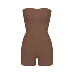 SEAMLESS SCULPT STRAPLESS SHORTIE BODYSUIT | JASPER (SHAPEWEAR BODYSUITS) LAYS FLAT ON A WHITE BACKGROUND | FLT